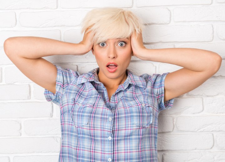 Newly blonde girl looking surprised