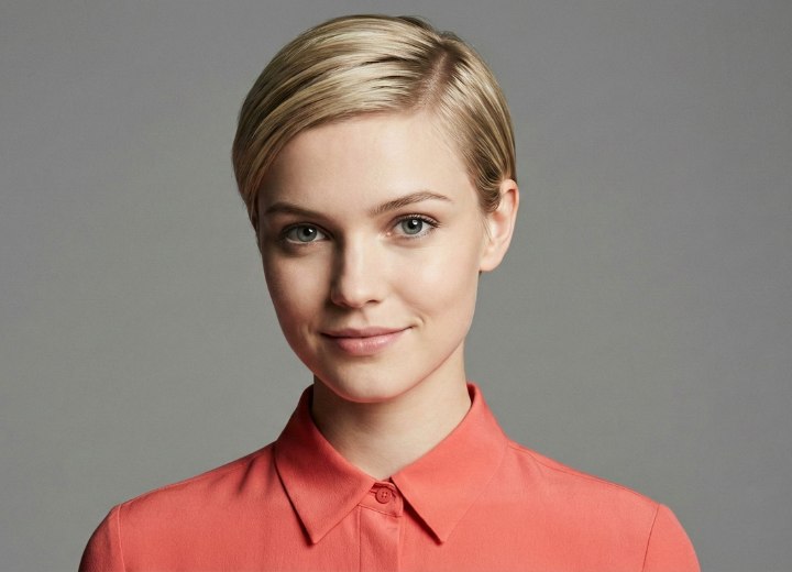Woman wearing her hair in a pixie cut with wet look gel styling