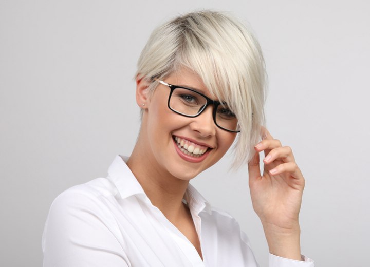 Woman with short blonde hair wearing glasses
