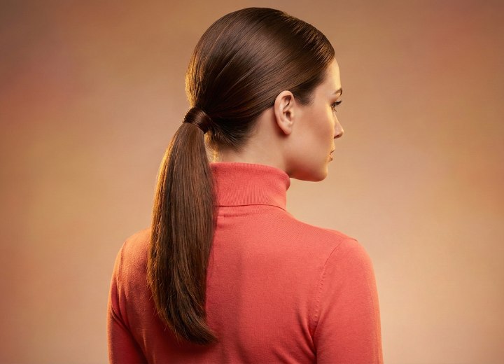 Woman wearing her long hair in a ponytail