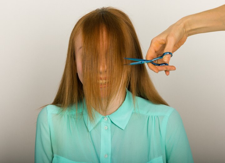 Hairdresser cutting bangs