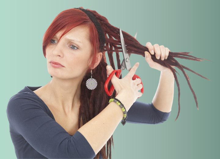 Girl cutting off her own dreadlocks