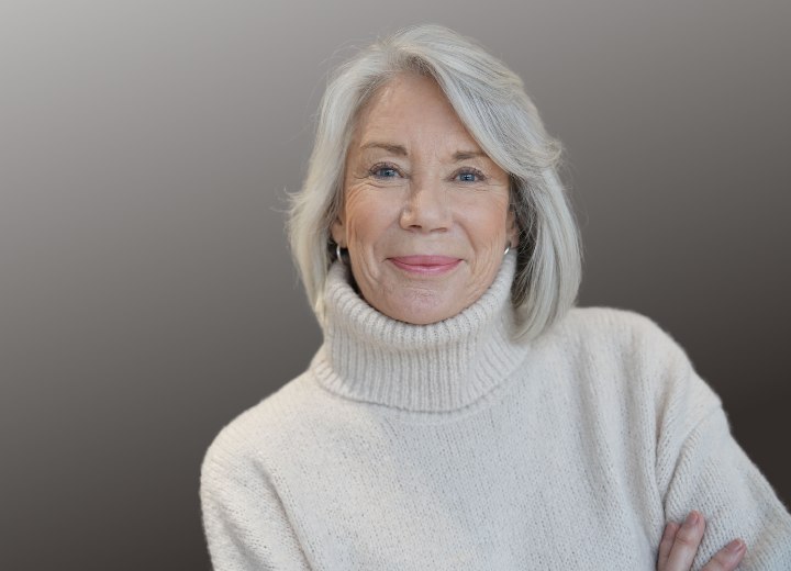 Older woman with gray hair wearing a turtleneck