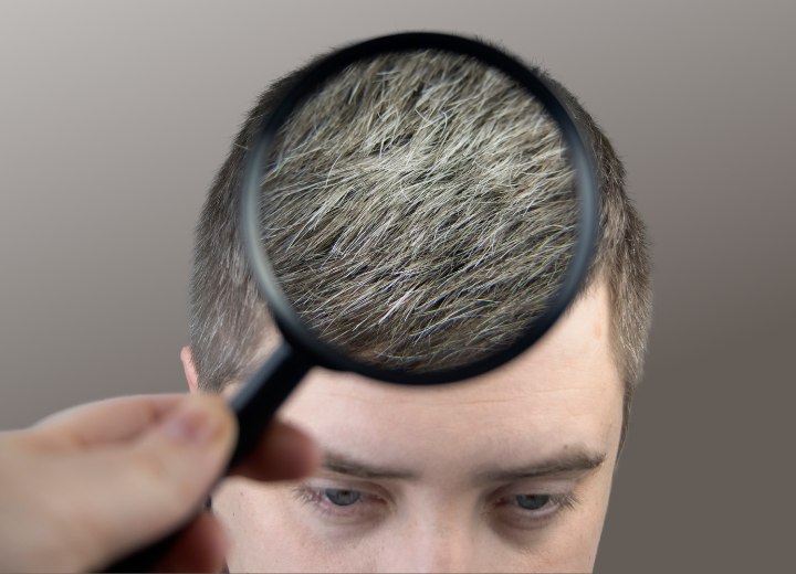 Scientist inspecting graying hair
