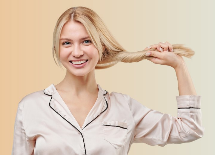 Woman with healthy long hair, wearing silk pajamas
