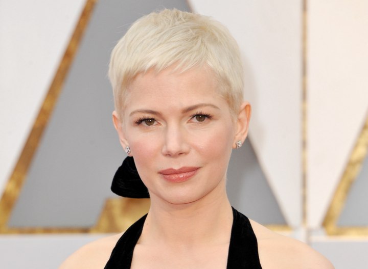 Michelle Williams with her hair in a bleached blonde pixie