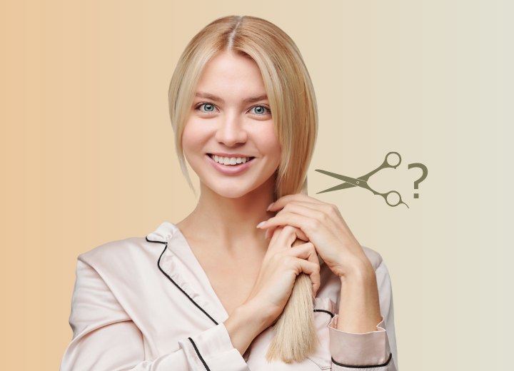 Woman in satin pajamas contemplating cutting her long hair short