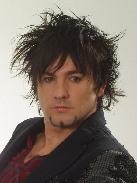 Razor cut men's hairstyle with a long fringe