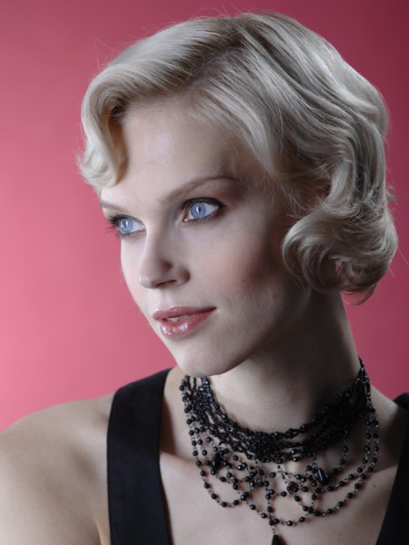Short festive 1930s hairstyle with soft waves