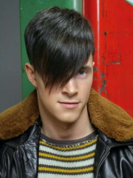 Man's hairstyle with very short sides and long top hair