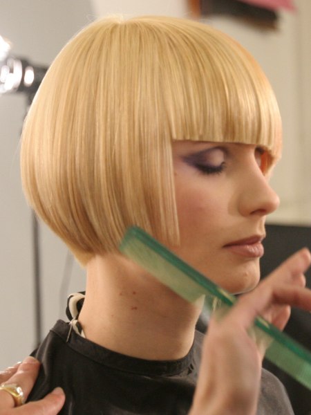 Side view of a short bob cut with angled bangs
