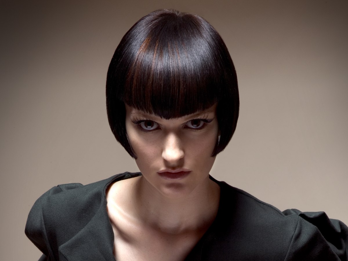 Short sleek bob hairstyle with with sides that curve inward