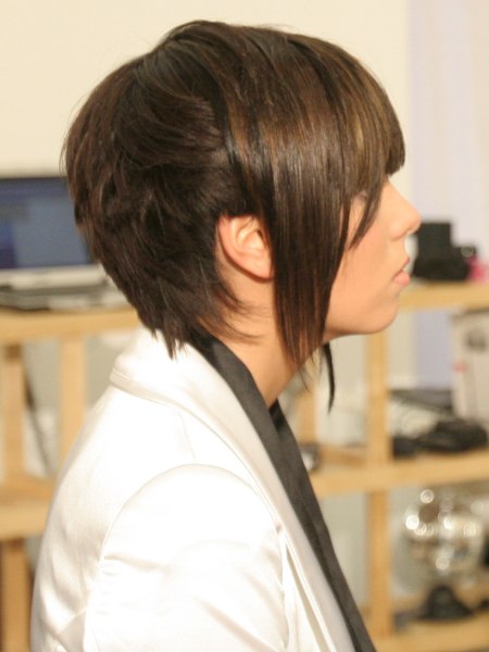 Side view of a short girls haircut with bangs