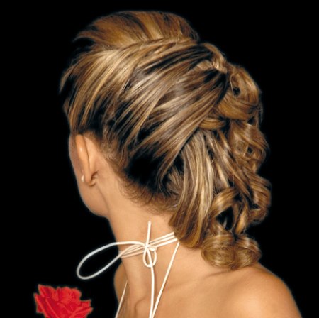Wedding hairstyle with thick coiled locks and silky curls