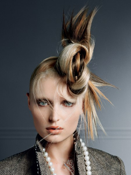 Blonde beige hair in an updo with knotted hair