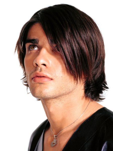 Trendy haircut for men with layers and long bangs
