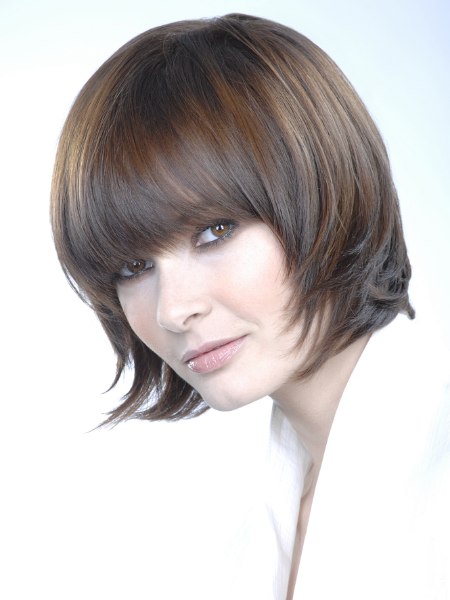 Modern chin length page cut with bangs and volume on top