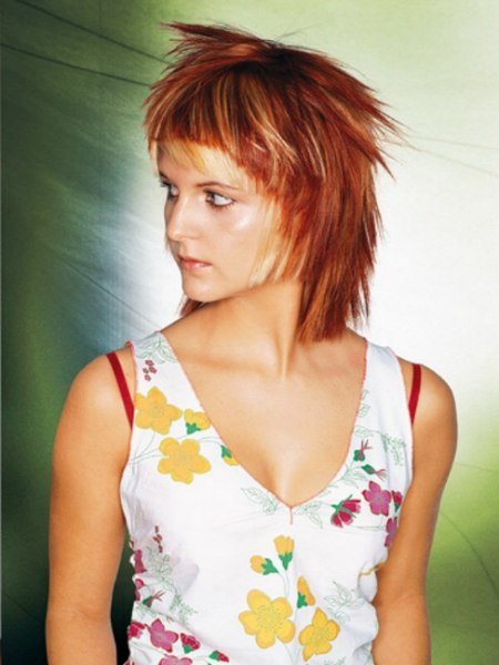 Free spirited choppy cut in a daring red hair color