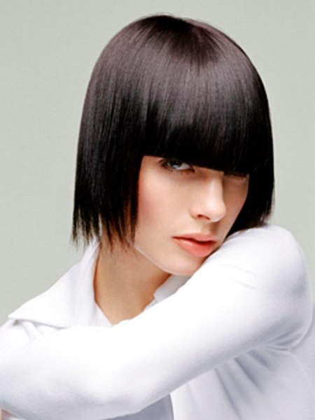 Medium length bob with squared pupil level bangs