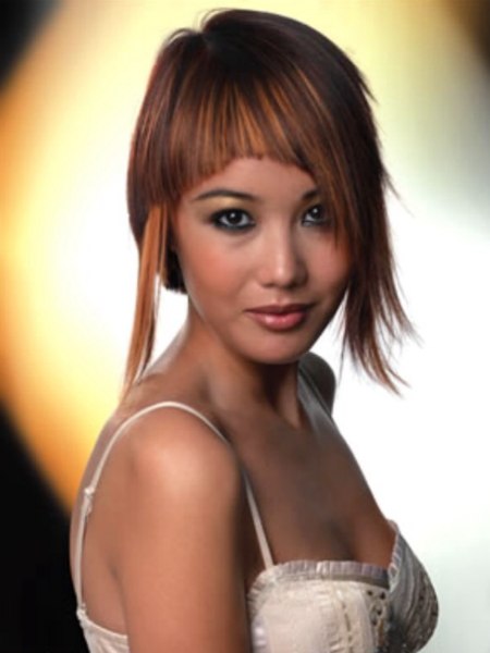 Eyecatching short hairstyle with one strand that is left long