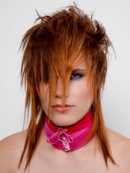 Punky shag hairstyle with forward into the face styling