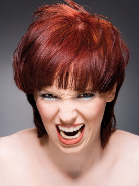 Short red hair in a classical mushroom cut