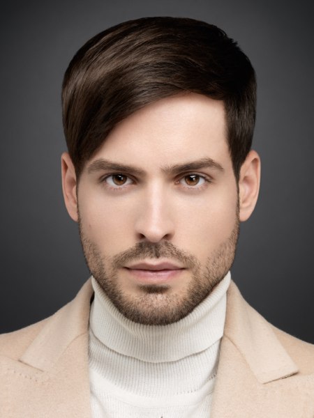 Man with a smart haircut and wearing a turtleneck