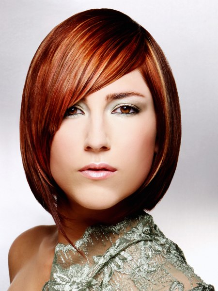 Chin length bob hairstyle with the fringe falling in a curve across the face