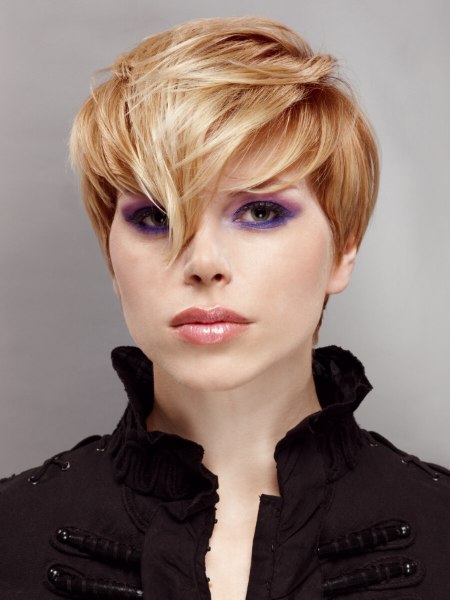 Modern short haircut with the bangs cut in a triangular shape