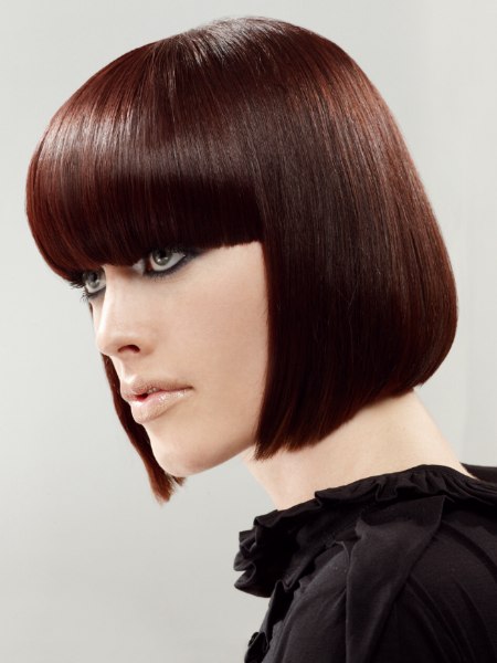 Side view of a shiny short pageboy hairstyle with straight sides