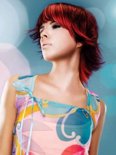Intense red hair color and a haircut with different styling variations