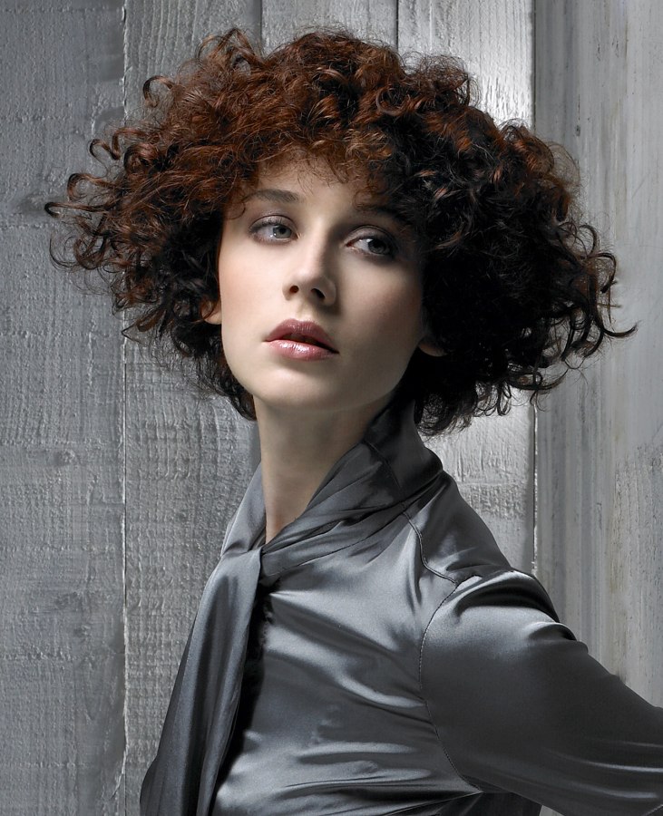 Naturally curly hair cut in a wedge shape to control the 