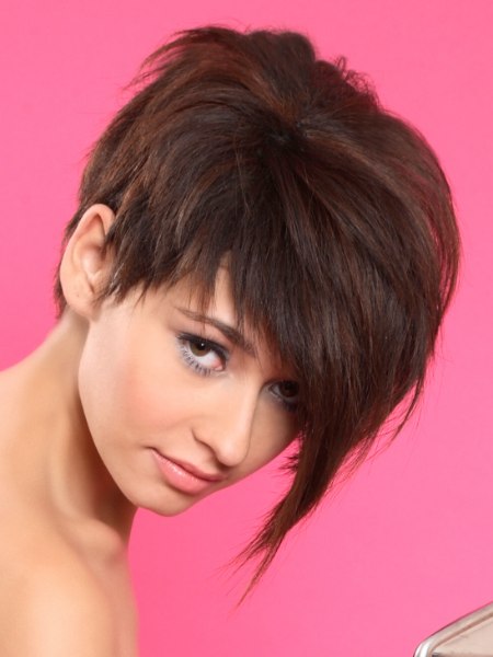 Pixie cut with a long forelock and razor-cut layers