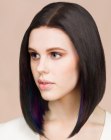 Long and smooth angled bob with a center part