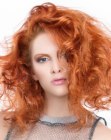 Curly red hair with a trapeze shape