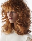 Shaggy medium length hairstyle with bed head curls