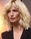 Blonde shoulder length bob with elements of the 1980s