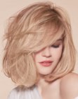 Long blonde bob with volume and bangs