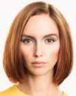 Shaggy medium length bob haircut with a shorter front section