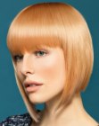 Medium-short A-line bob with feathered hair along the face