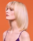 Long voluminous bob with tapered sides and 1970s elements