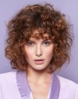 Medium length hairstyle for voluminous curly hair