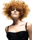 Reddish blonde hair with corkscrew curls