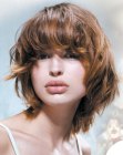 Face framing haircut with bangs for mid-length hair