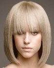 Just above the shoulders bob with a soft long fringe