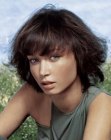 Round haircut with layers for chestnut hair