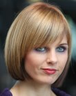 Timeless bob haircut with tapered sides and bangs