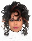 Hair with an ebony color and corkscrew curls