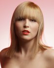 Shoulder level bob with over-cut layers and curved bangs