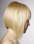 Mid-length bob with tapered sides an a steep cutting angle from back to front